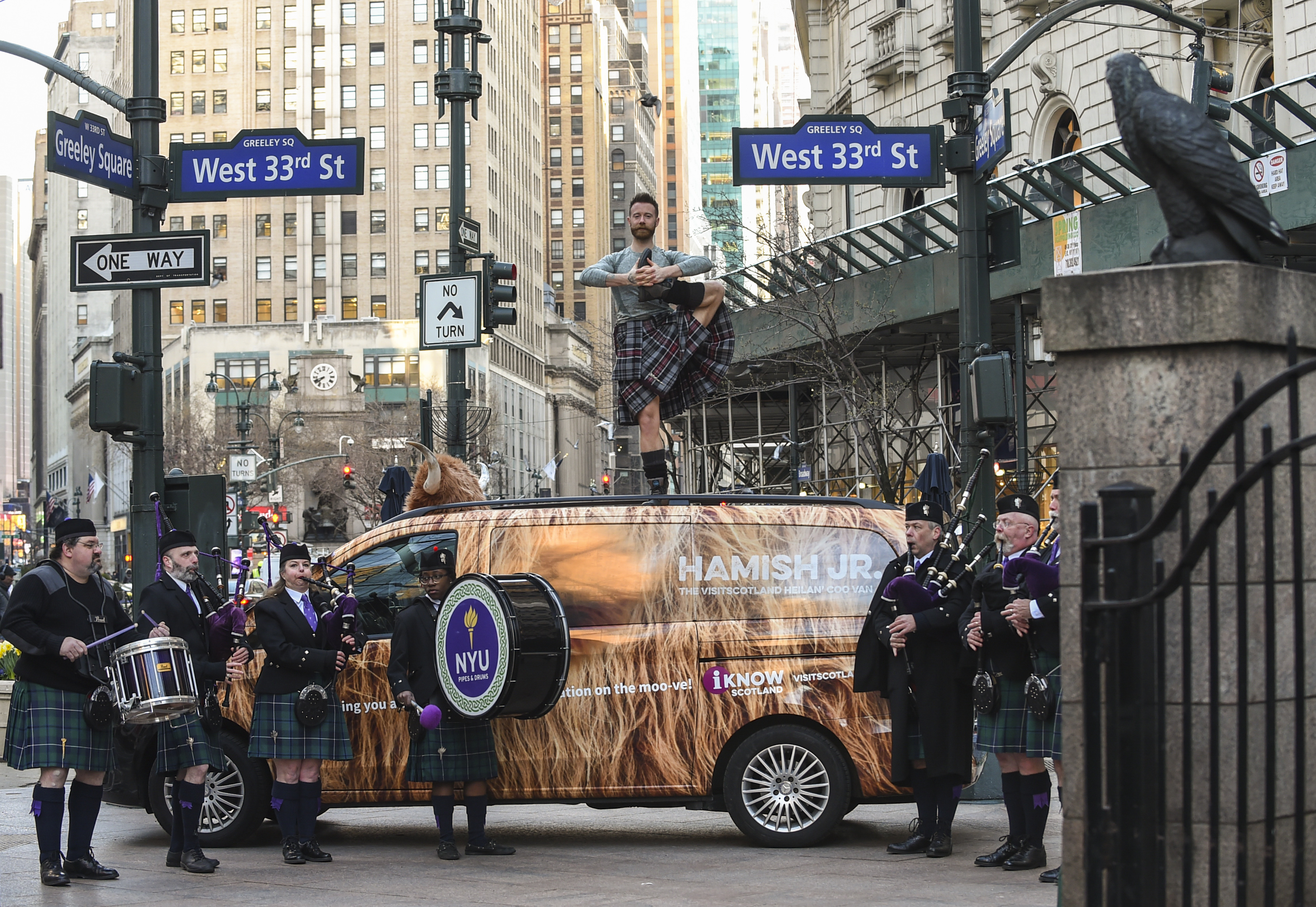 Hamish The Coo van & man doing yoga in a kilt in NYC