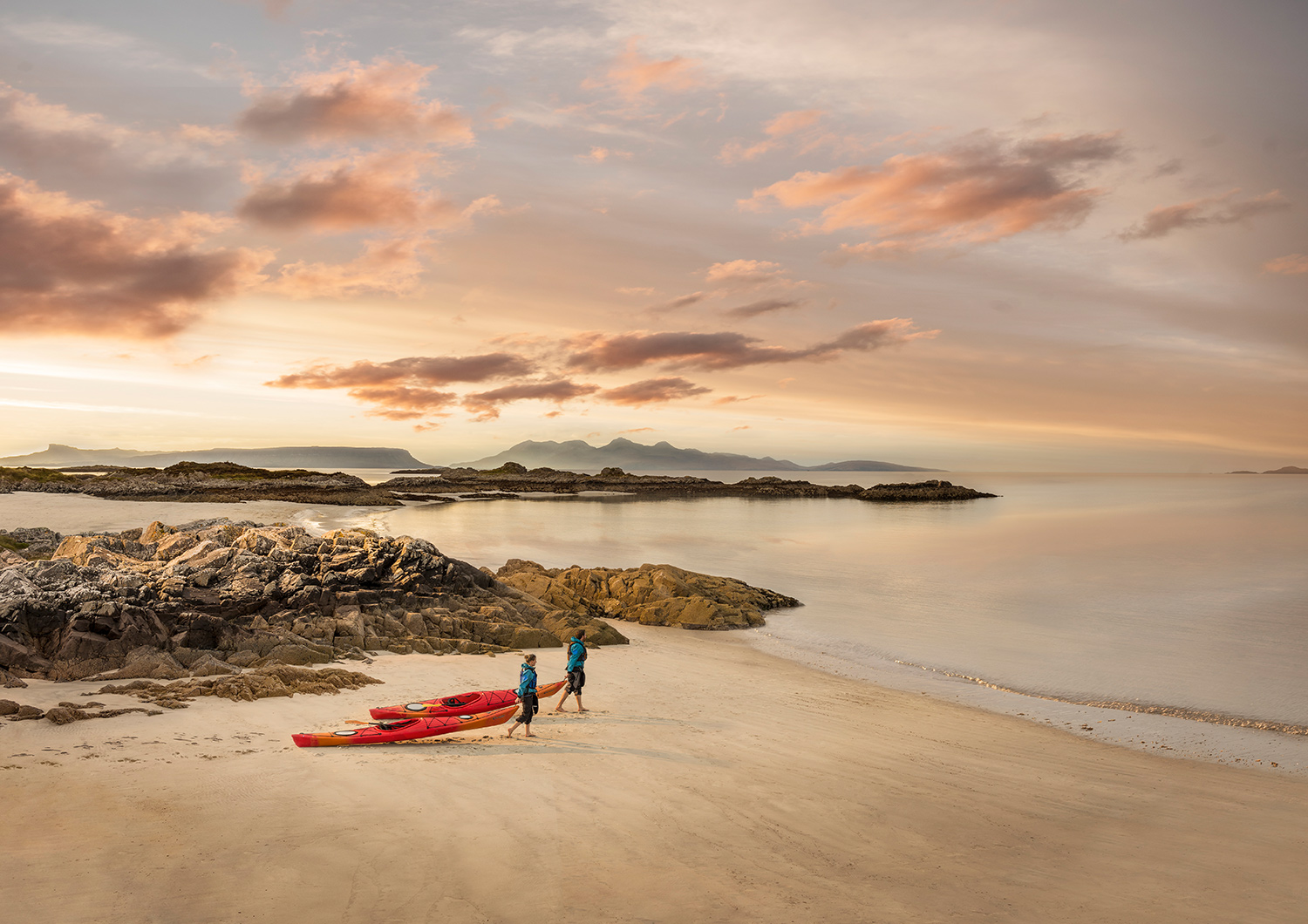 Kayakers take their boats to the shoreline